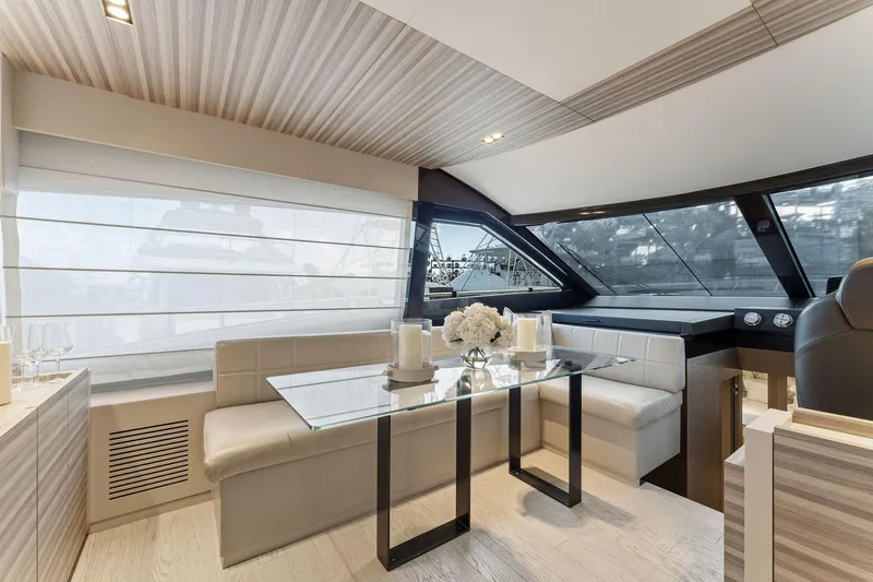 Only One Yacht Photos Pics Luxurious interior of 2020 Ferretti Yachts 670 with elegant dining area and panoramic windows.