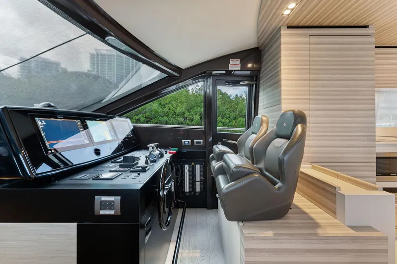 Only One Yacht Photos Pics Modern helm station of 2020 Ferretti Yachts 670 with sleek design and advanced controls.