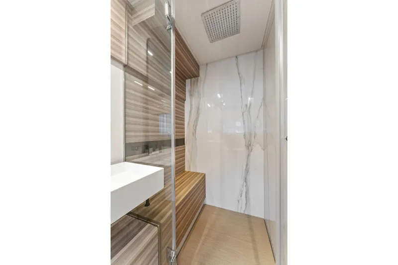 Only One Yacht Photos Pics Luxurious bathroom interior of 2020 Ferretti Yachts 670 with modern design and marble accents.