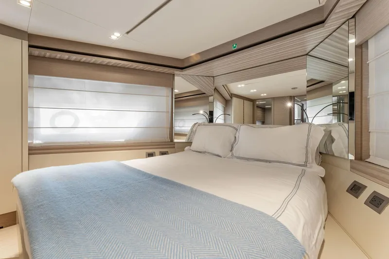 Only One Yacht Photos Pics Luxurious bedroom interior of 2020 Ferretti Yachts 670 with elegant bedding and modern design.