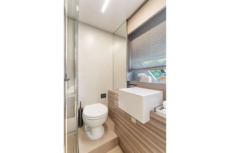 Only One Yacht Photos Pics Modern bathroom interior on 2020 Ferretti Yachts 670, featuring sleek design and natural lighting.