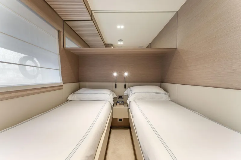 Only One Yacht Photos Pics Luxurious twin cabin interior on 2020 Ferretti Yachts 670, featuring modern design and cozy ambiance.