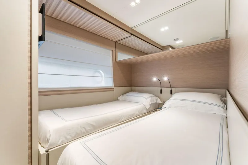 Only One Yacht Photos Pics Luxurious twin bedroom in 2020 Ferretti Yachts 670, featuring modern design and ambient lighting.
