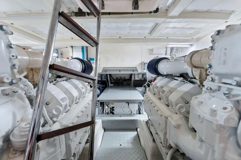 Only One Yacht Photos Pics Engine room of 2020 Ferretti Yachts 670, featuring dual engines and ladder access.
