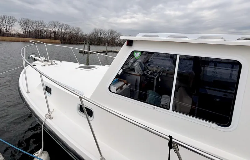 Riverwind Yacht Photos Pics 2008 Eastern Casco Bay 31 boat docked on a cloudy day.
