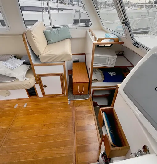 Riverwind Yacht Photos Pics Interior of 2008 Eastern Casco Bay 31 boat with wooden flooring and seating area.
