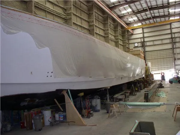  Yacht Photos Pics 2022 Westport hull under construction in a large indoor facility.