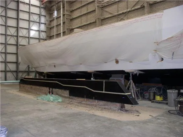  Yacht Photos Pics 2022 Westport HULL ONLY project in a shipyard, partially covered, awaiting completion.