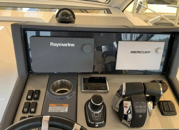  Yacht Photos Pics Control panel of 2018 Cruisers 390 Express Coupe with Raymarine and Mercury displays.