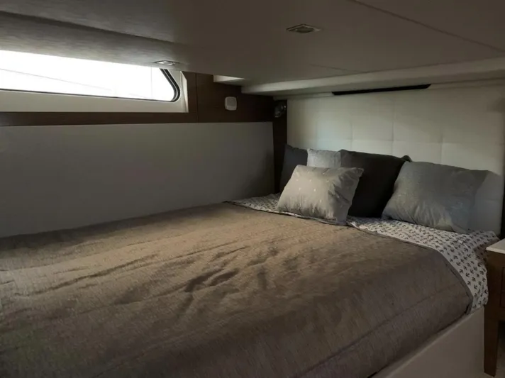  Yacht Photos Pics Luxurious cabin interior of 2018 Cruisers 390 Express Coupe with cozy bedding.
