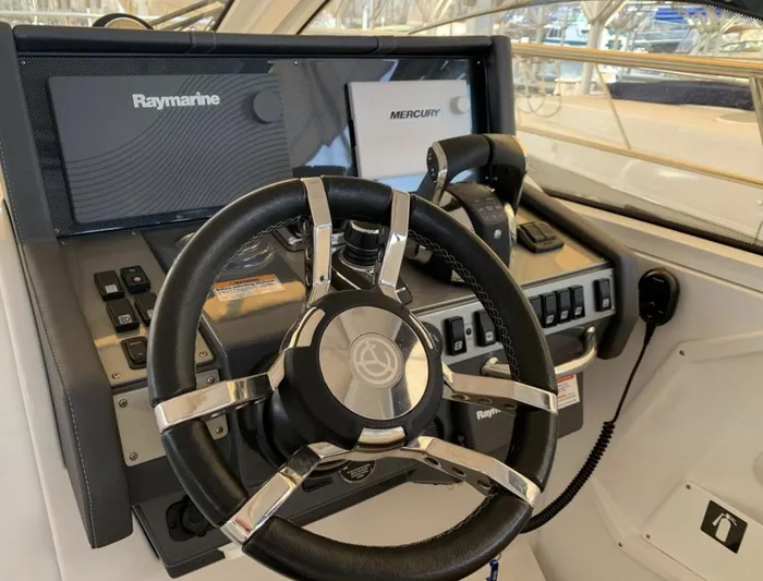  Yacht Photos Pics 2018 Cruisers 390 Express Coupe helm with Raymarine and Mercury controls.