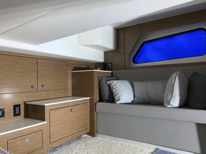  Yacht Photos Pics 2018 Cruisers 390 Express Coupe interior with modern wood cabinetry and cozy seating.