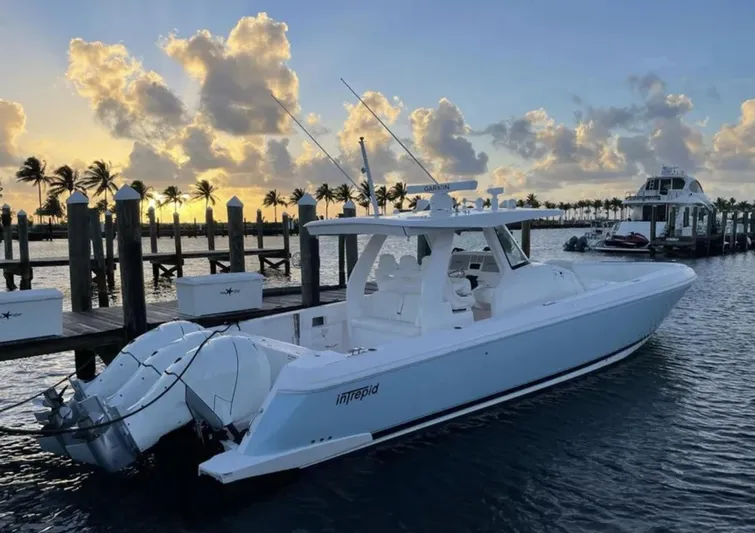  Yacht Photos Pics Intrepid 407 Nomad SE 2022 boat docked at sunset.