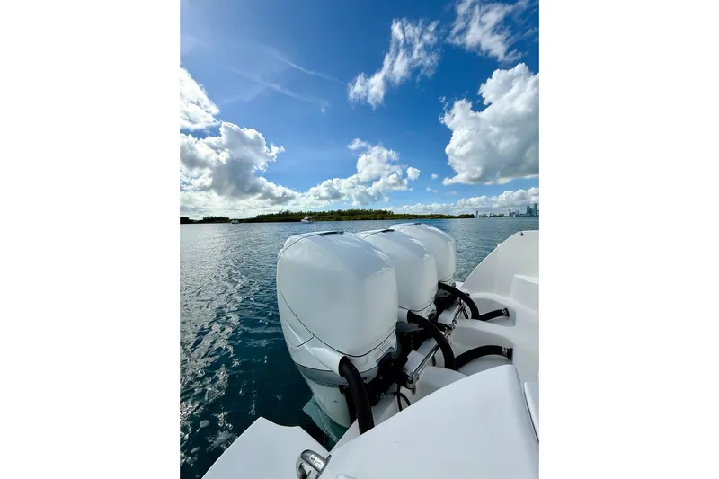 Yacht Photos Pics 2022 Intrepid 407 Nomad SE boat engines on a sunny day, ocean view.