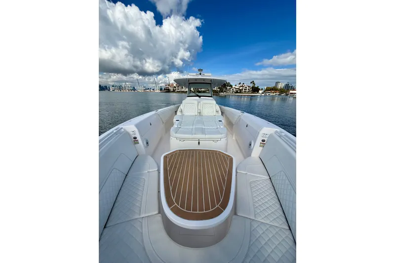  Yacht Photos Pics 2022 Intrepid 407 Nomad SE boat on calm water under a blue sky.