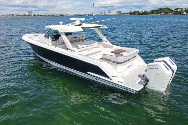 Marilee Yacht Photos Pics 2024 Tiara Yachts 43 LS luxury boat on clear blue water, featuring twin Mercury engines.