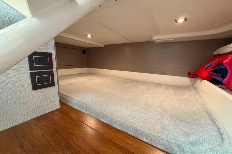 Marilee Yacht Photos Pics 2024 Tiara Yachts 43 LS cabin interior with bed and modern lighting.