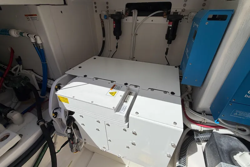 Marilee Yacht Photos Pics Engine compartment of 2024 Tiara Yachts 43 LS, showcasing electrical components and wiring.