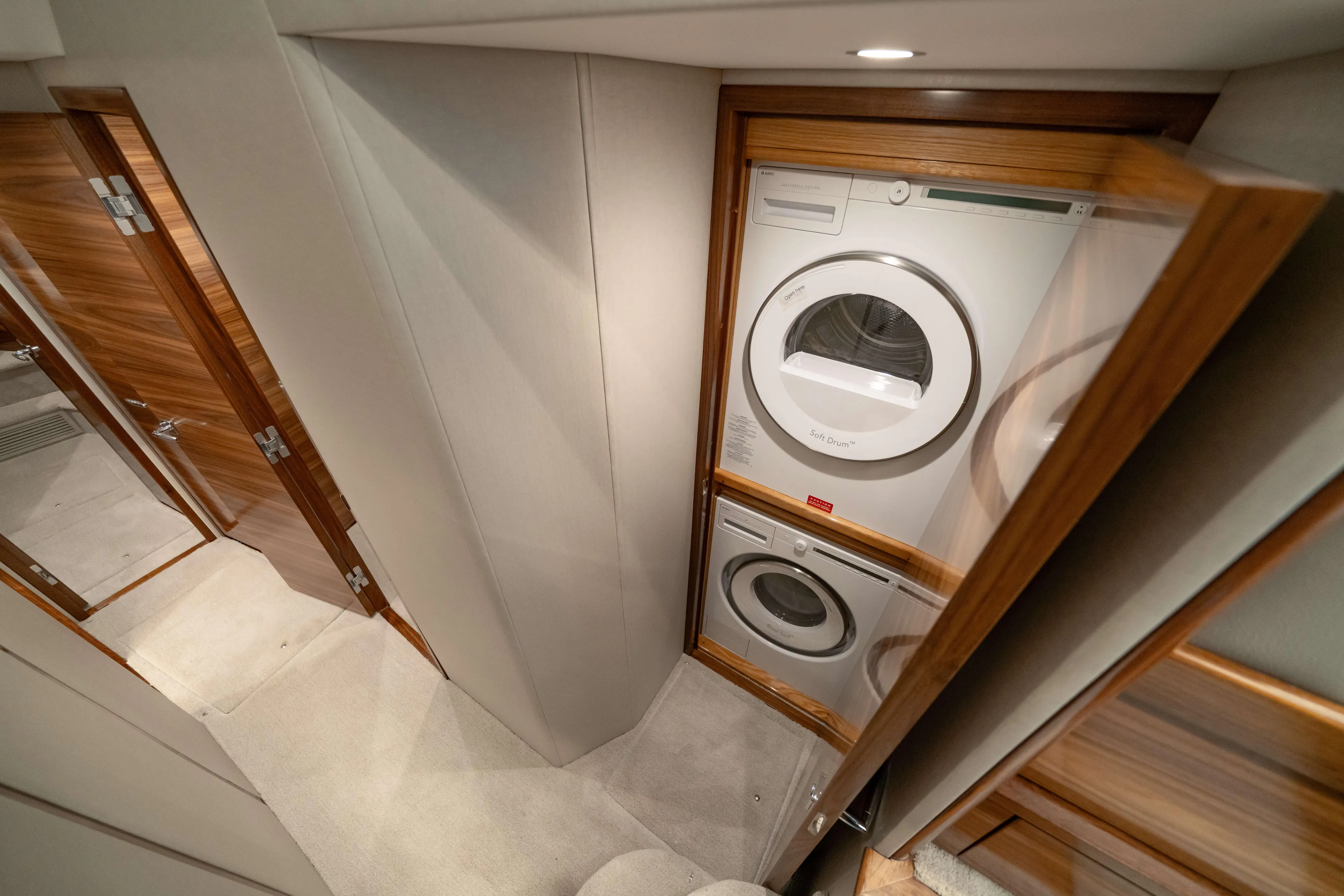 2026 Viking 50c Yacht Photos Pics Laundry area in 2026 Viking 50 Convertible yacht with stacked washer and dryer.