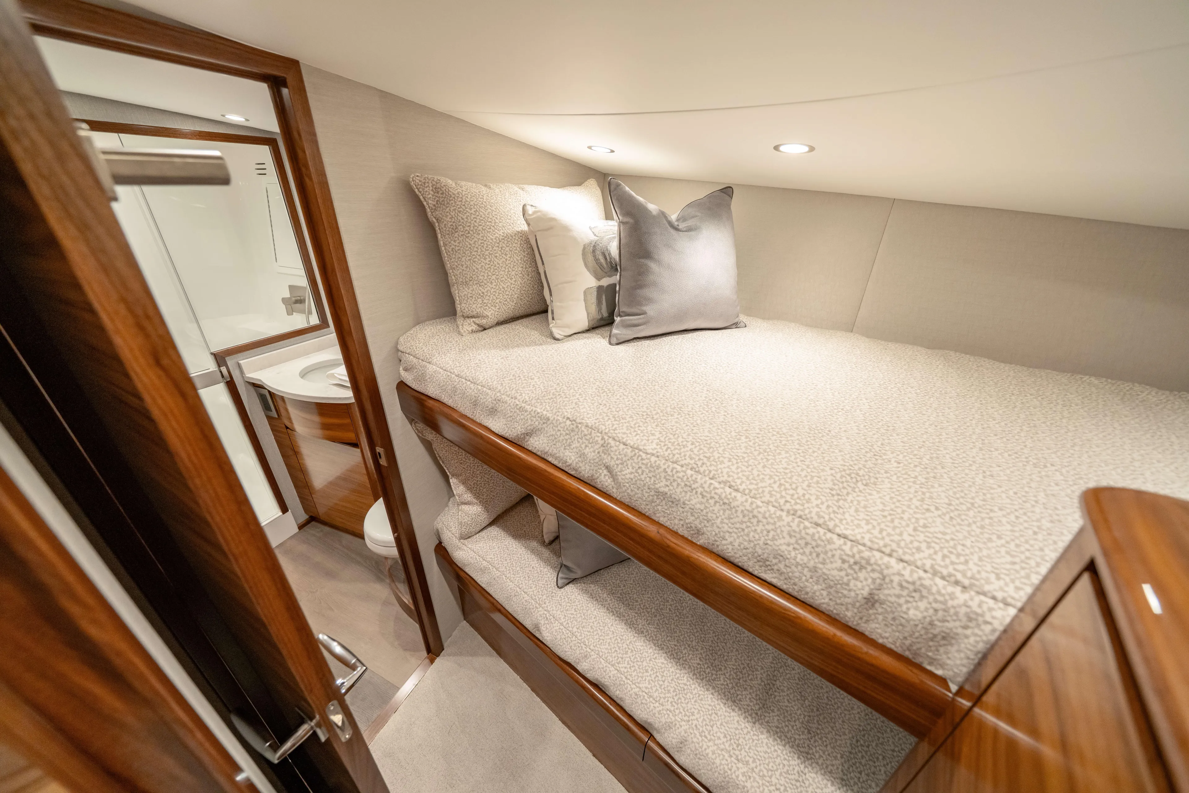 2026 Viking 50c Yacht Photos Pics Luxurious cabin interior of 2026 Viking 50 Convertible yacht with cozy bunk beds.