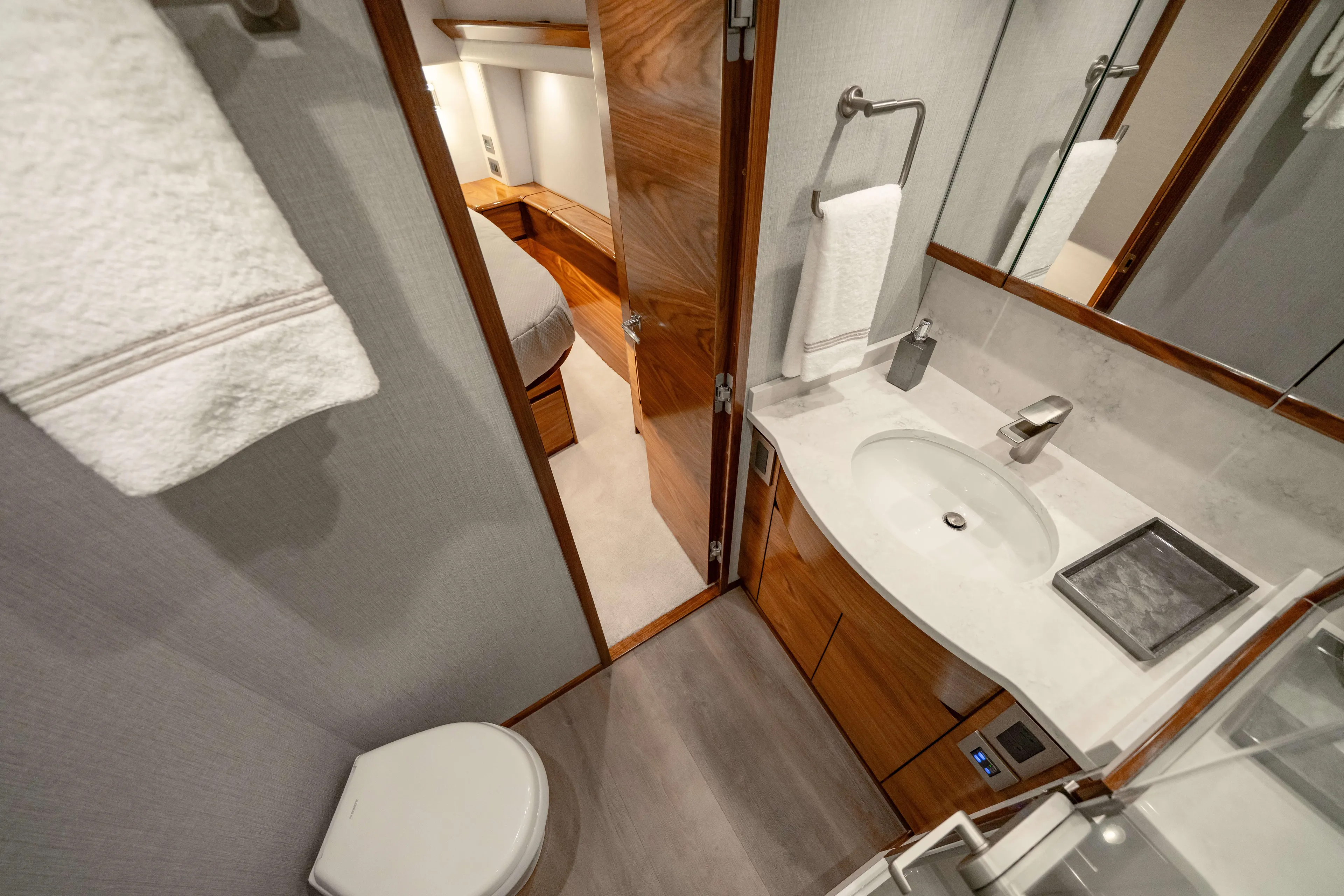 2026 Viking 50c Yacht Photos Pics Luxurious bathroom interior of 2026 Viking 50 Convertible yacht, featuring modern fixtures and wood accents.