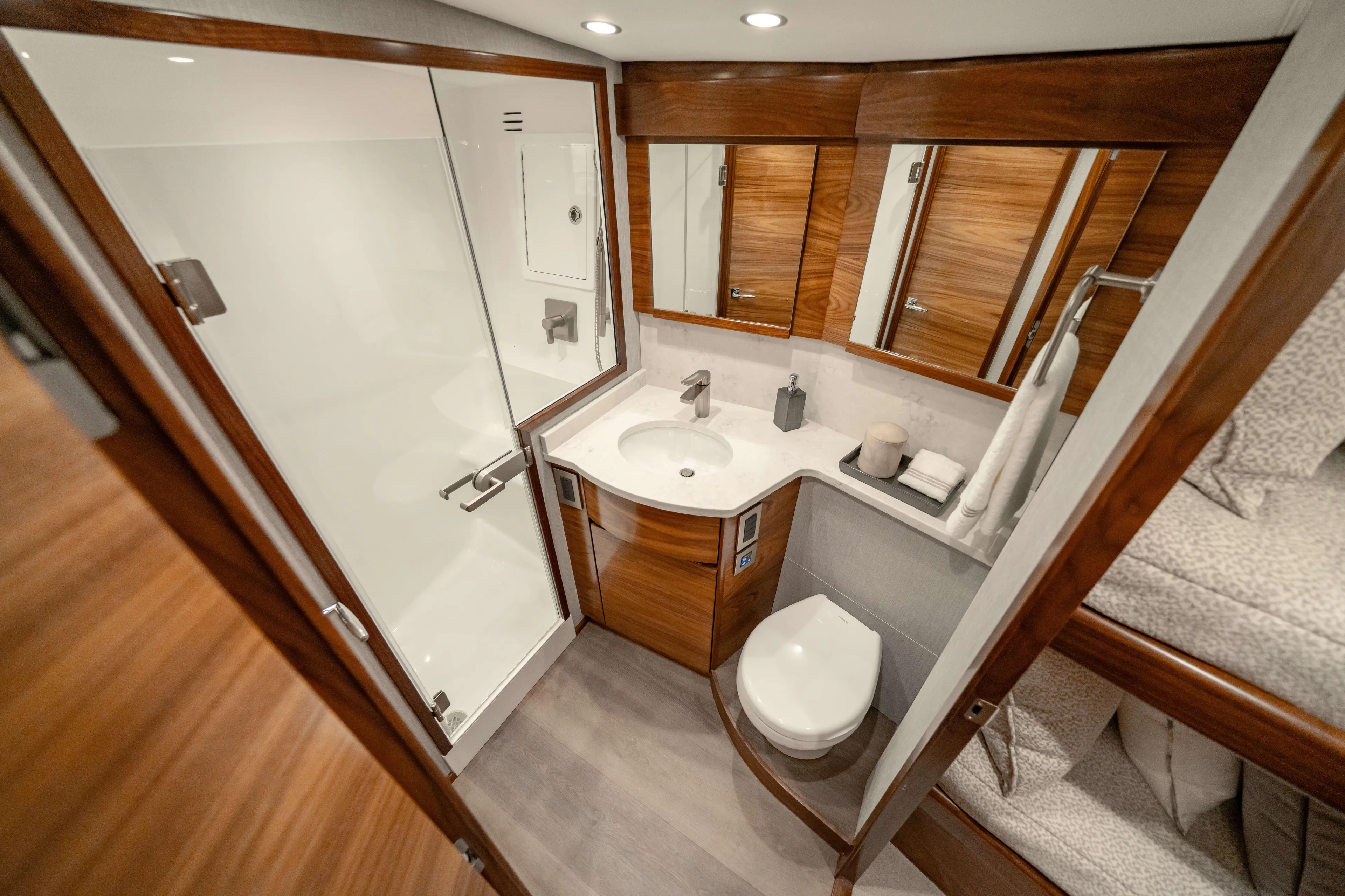 2026 Viking 50c Yacht Photos Pics Luxurious bathroom in 2026 Viking 50 Convertible yacht with modern fixtures and wood accents.