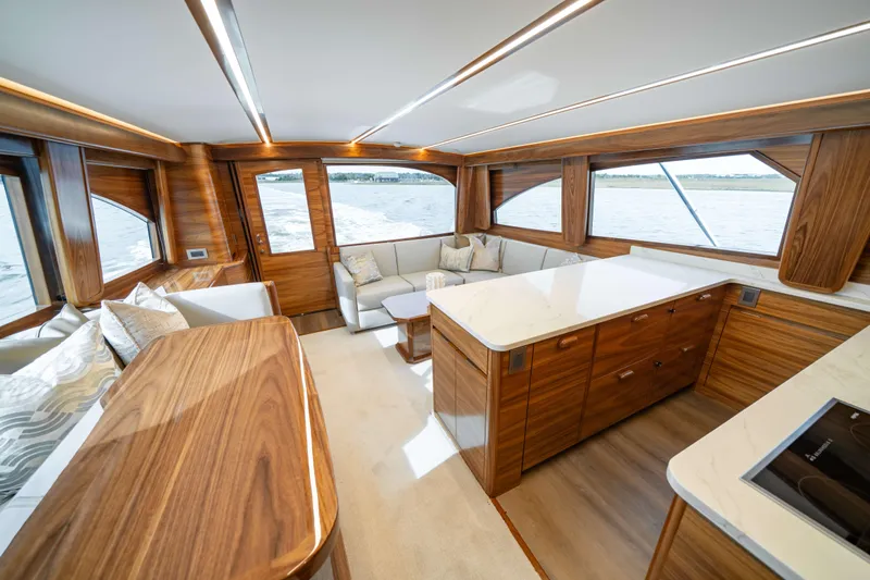 2026 Viking 50c Yacht Photos Pics Luxurious interior of 2026 Viking 50 Convertible yacht with elegant wood finishes.