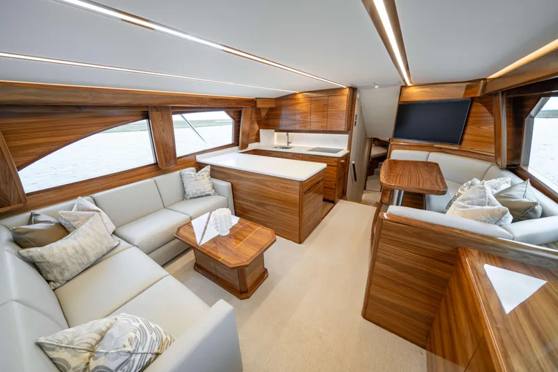 2026 Viking 50c Yacht Photos Pics Luxurious interior of 2026 Viking 50 Convertible yacht with elegant wood finishes and plush seating.