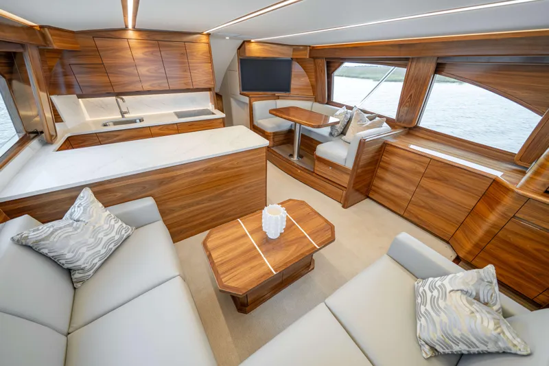 2026 Viking 50c Yacht Photos Pics Luxurious interior of 2026 Viking 50 Convertible yacht with elegant wood finishes.