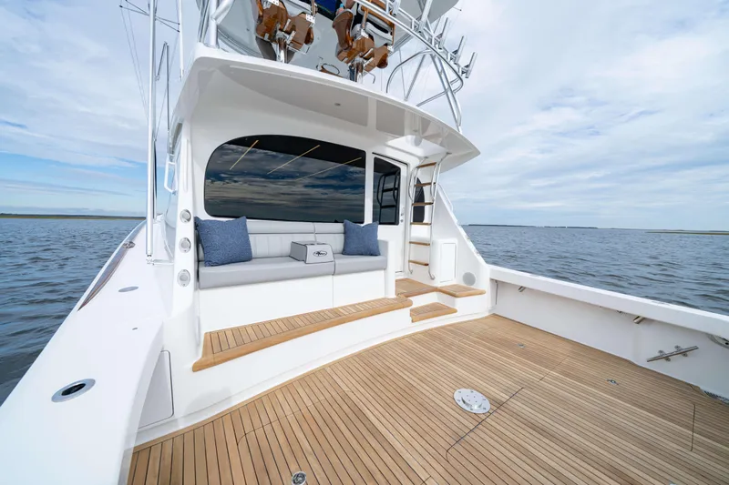 2026 Viking 50c Yacht Photos Pics 2026 Viking 50 Convertible yacht with spacious deck and seating, cruising on open water.