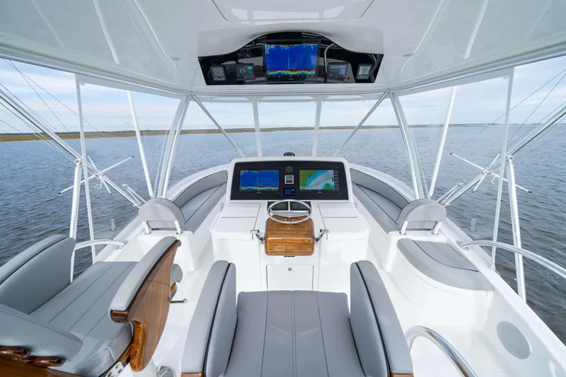 2026 Viking 50c Yacht Photos Pics 2026 Viking 50 Convertible yacht helm with advanced navigation systems on open water.
