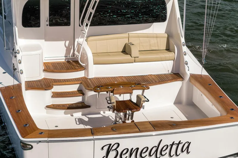 Benedetta Yacht Photos Pics Luxurious 2012 Viking 70 Enclosed Bridge yacht with elegant teak deck and seating area.