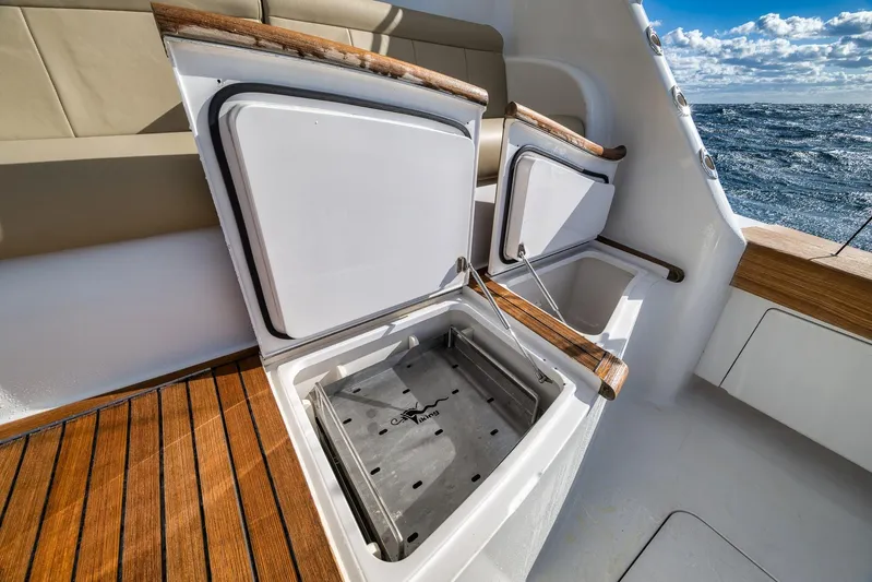 Benedetta Yacht Photos Pics Open storage compartments on 2012 Viking 70 Enclosed Bridge yacht with ocean view.