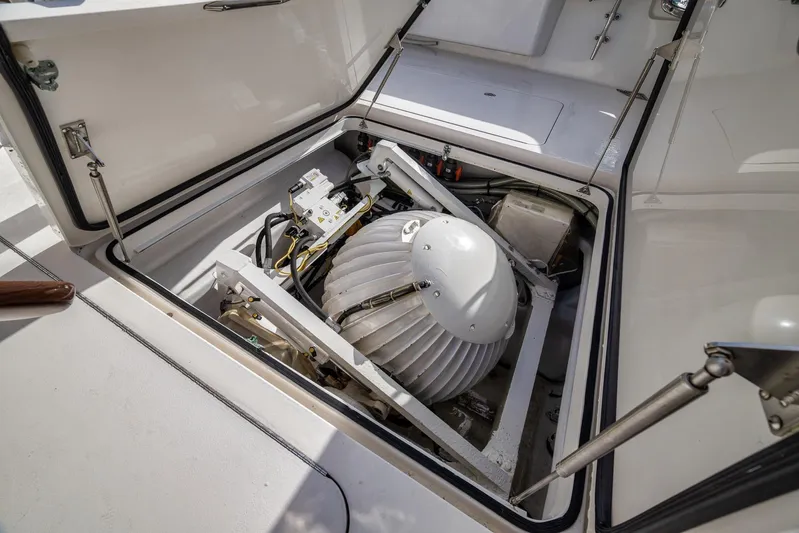 Benedetta Yacht Photos Pics Engine compartment of 2012 Viking 70 Enclosed Bridge yacht, showcasing mechanical components.