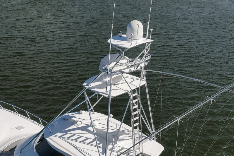 Benedetta Yacht Photos Pics 2012 Viking 70 Enclosed Bridge yacht tower over water.