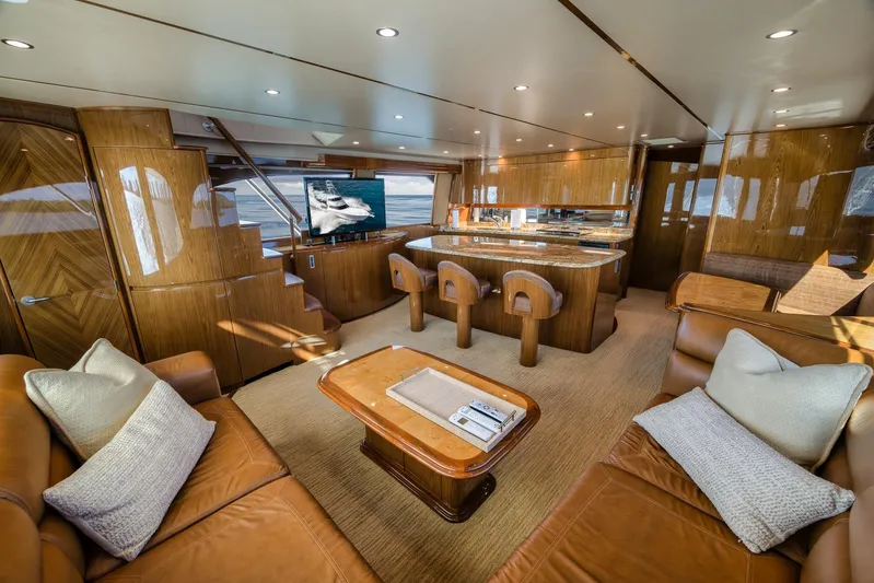 Benedetta Yacht Photos Pics Luxurious interior of 2012 Viking 70 Enclosed Bridge yacht with elegant wood finishes.