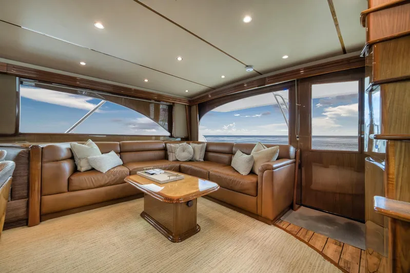 Benedetta Yacht Photos Pics Luxurious interior of 2012 Viking 70 Enclosed Bridge yacht with leather seating and ocean view.