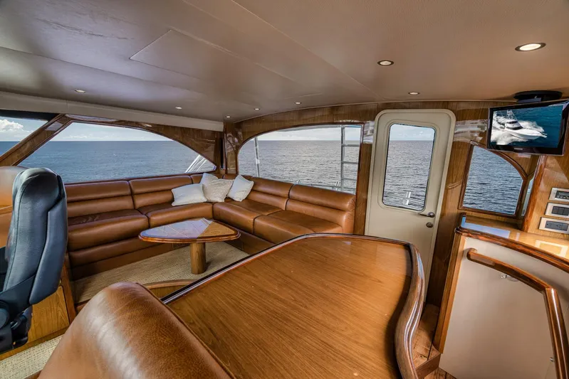 Benedetta Yacht Photos Pics Luxurious interior of 2012 Viking 70 Enclosed Bridge yacht with ocean view.