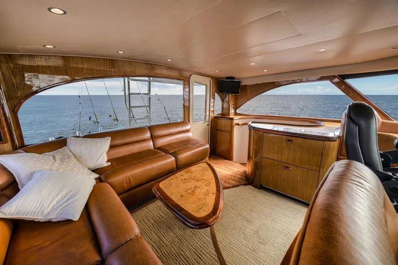 Benedetta Yacht Photos Pics Luxurious interior of 2012 Viking 70 Enclosed Bridge yacht with ocean view.