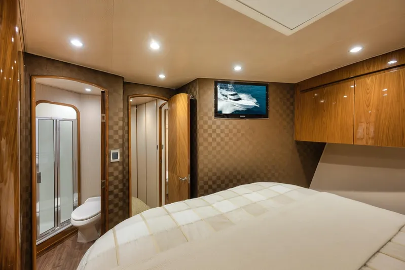 Benedetta Yacht Photos Pics Luxurious interior of 2012 Viking 70 Enclosed Bridge yacht with bedroom and bathroom.