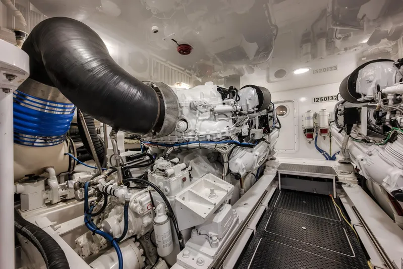 Benedetta Yacht Photos Pics Engine room of 2012 Viking 70 Enclosed Bridge yacht, showcasing powerful machinery and equipment.