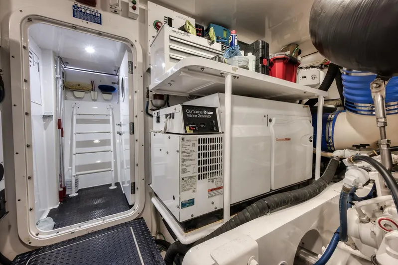 Benedetta Yacht Photos Pics Engine room of 2012 Viking 70 Enclosed Bridge yacht with Cummins Onan generator.