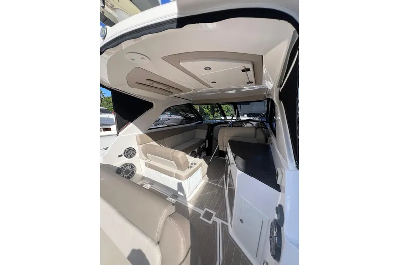  Yacht Photos Pics 2015 Regal 35 Sport Coupe interior with seating and helm, showcasing luxury design.