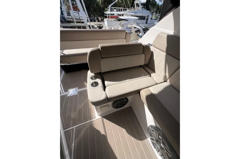  Yacht Photos Pics 2015 Regal 35 Sport Coupe interior with beige seating and cup holders.