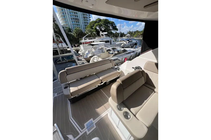 Yacht Photos Pics 2015 Regal 35 Sport Coupe interior with beige seating at marina.