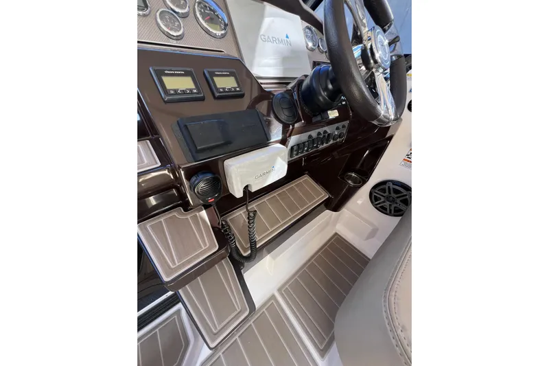  Yacht Photos Pics 2015 Regal 35 Sport Coupe dashboard with Garmin navigation and control panels.