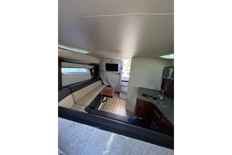  Yacht Photos Pics Luxurious interior of 2015 Regal 35 Sport Coupe with modern amenities and sleek design.