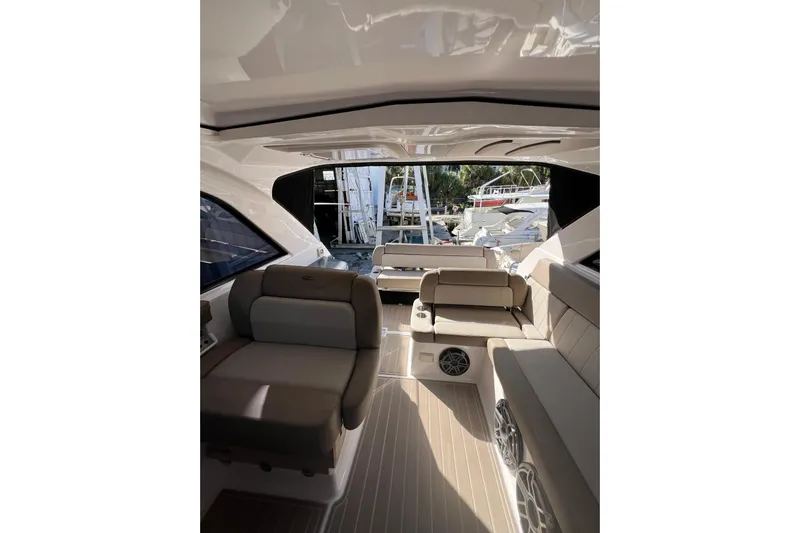  Yacht Photos Pics 2015 Regal 35 Sport Coupe interior with beige seating and modern design.