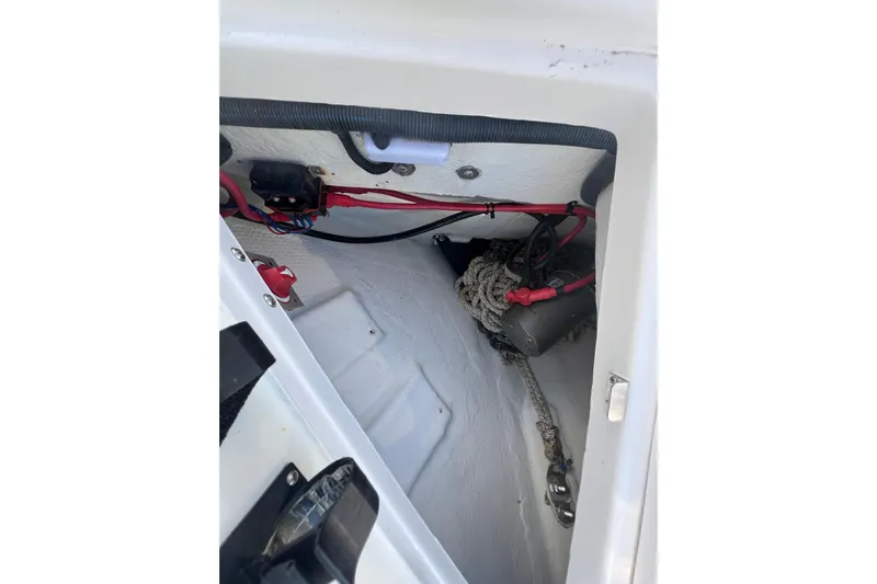  Yacht Photos Pics 2015 Regal 35 Sport Coupe interior compartment with wiring and rope storage.