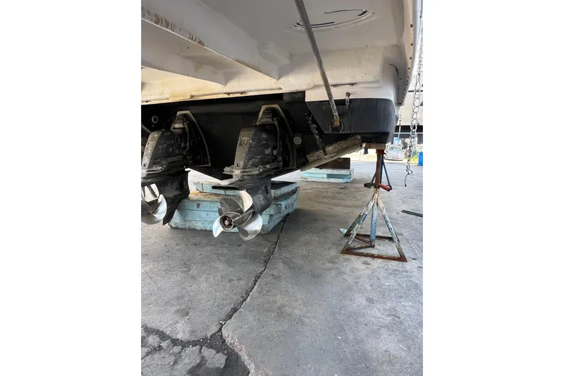  Yacht Photos Pics 2015 Regal 35 Sport Coupe boat on stands, showing dual propellers.